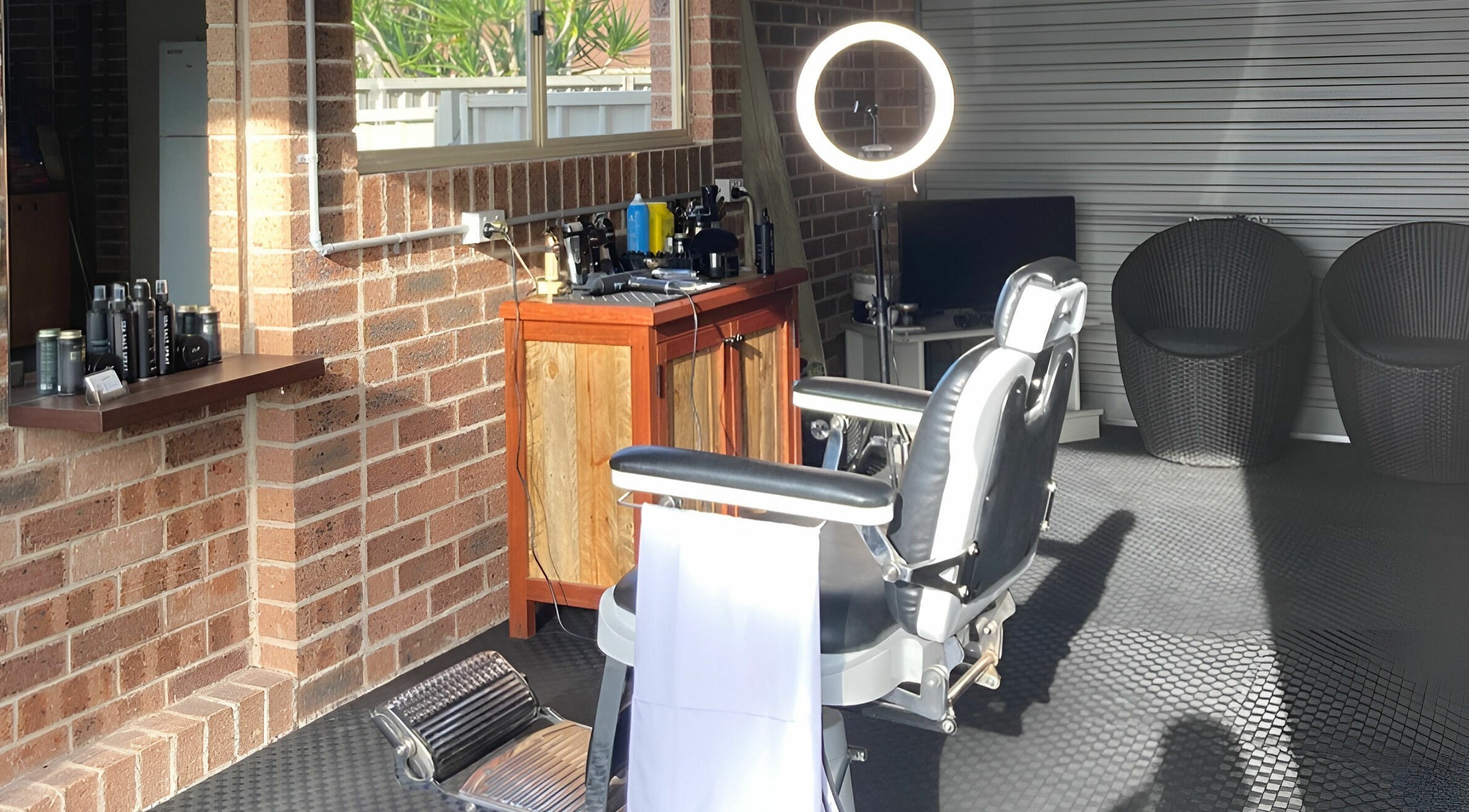 Bright barber chair setup at Kavi's Kutz, Kariong, New South Wales, AU with modern decor and lighting.