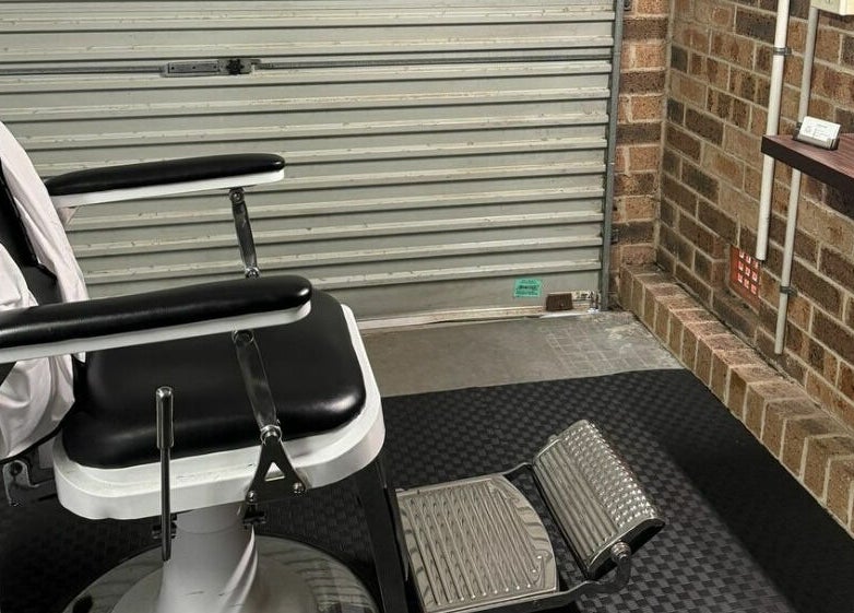 Modern barber chair at Kavi's Kutz, Kariong, New South Wales, AU, showcasing sleek design and comfort.