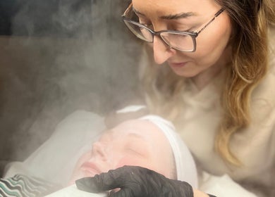 Facial treatment at D2 Hair Skin and Beauty, Worlingham, England; beautician applies mask amidst steam.