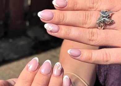 Beautiful French manicure at D2 Hair Skin and Beauty, Worlingham, England, GB with floral accents.