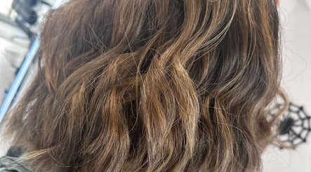 Highlighted wavy hair styled at D2 Hair Skin and Beauty in Worlingham, England, GB.