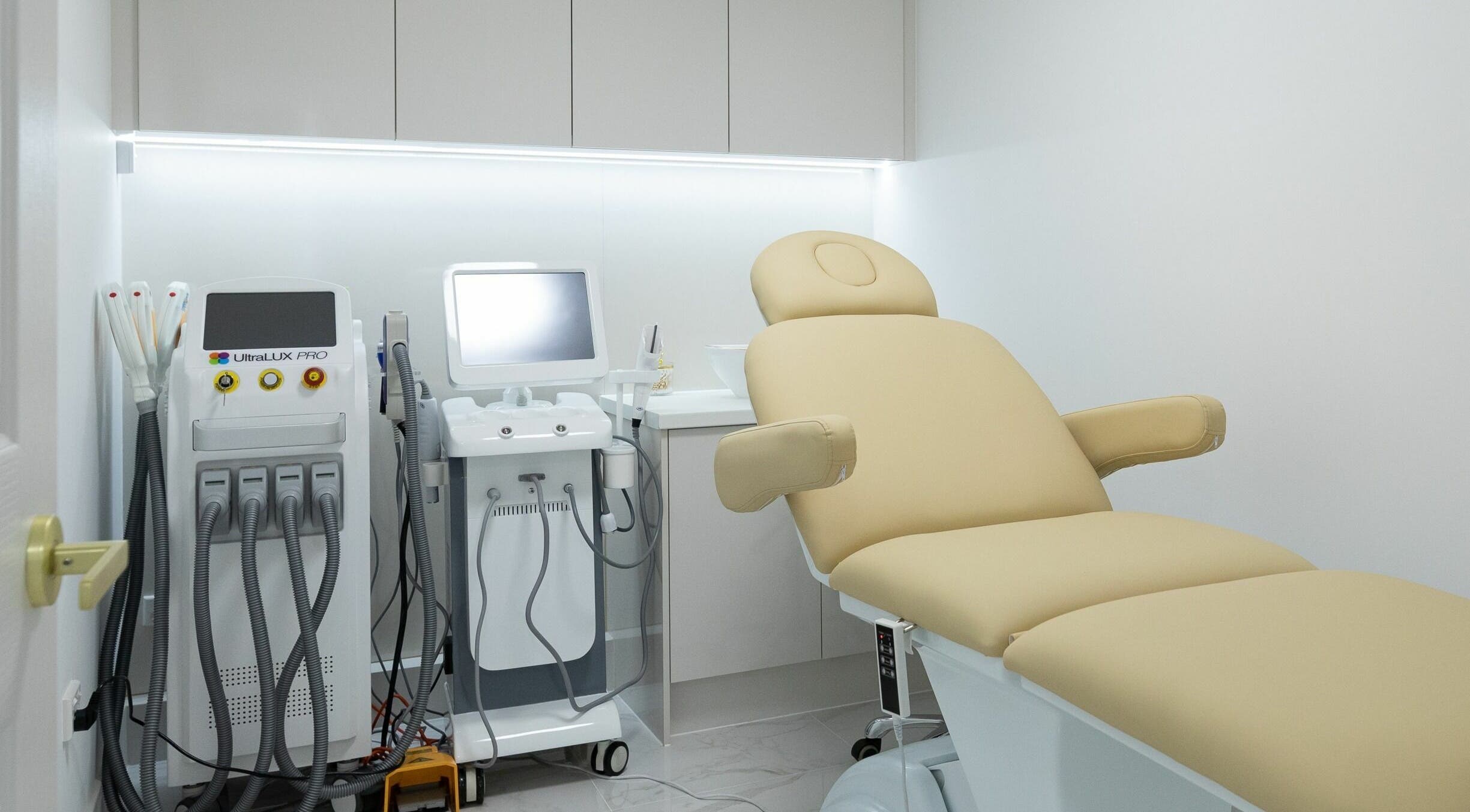 Modern treatment room at Unique Beauty & Laser Clinic North Adelaide, South Australia, AU featuring laser equipment.