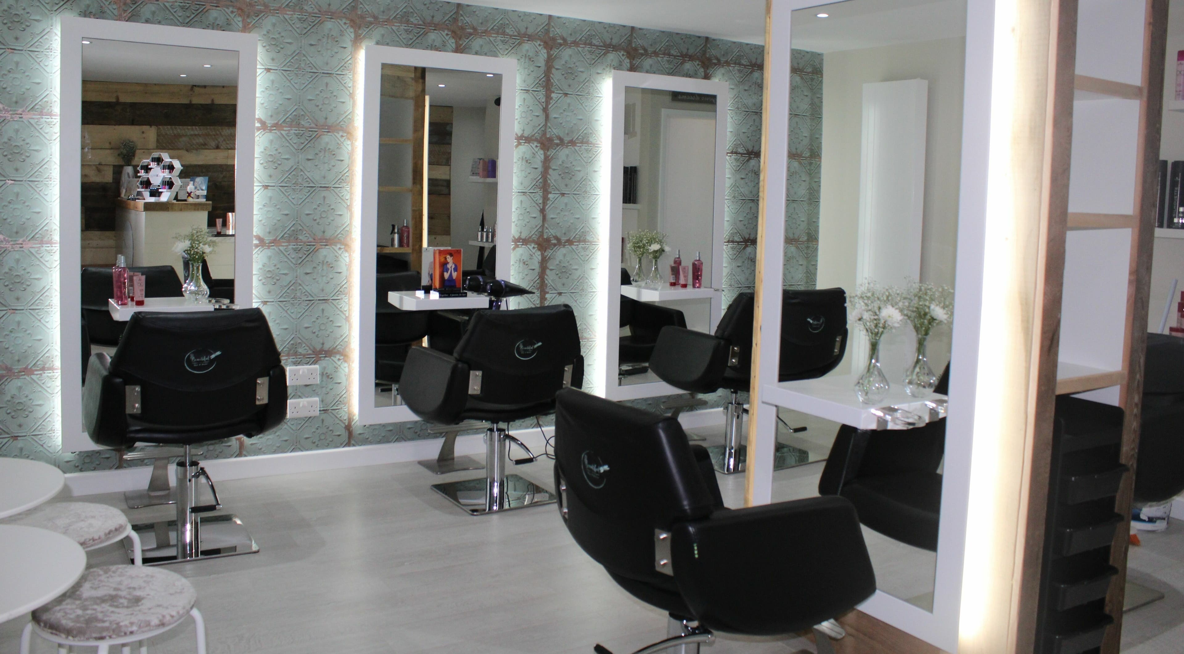 Modern interior of B Beautiful Hair and Beauty Salon in Aberford, England, GB showcasing sleek salon chairs and mirrors.