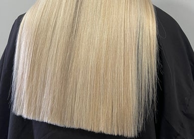 Elegant straight blonde hair styling by Lauren Pomphrey Hairdressing in Andover, England, GB.