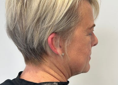 Sophisticated short haircut at Lauren Pomphrey Hairdressing in Andover, England, GB showcases chic gray layers.