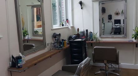 Modern styling station at Sabrina Kennyford Hairdressing, Wootton Bridge, England with mirrors and salon chairs.