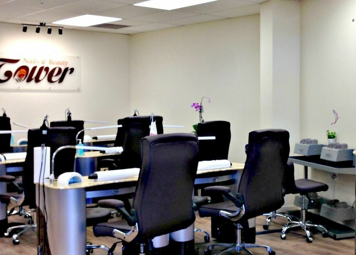 Modern nail salon at Tower Beauty Christchurch, Canterbury, NZ featuring chic workstations and calming decor.