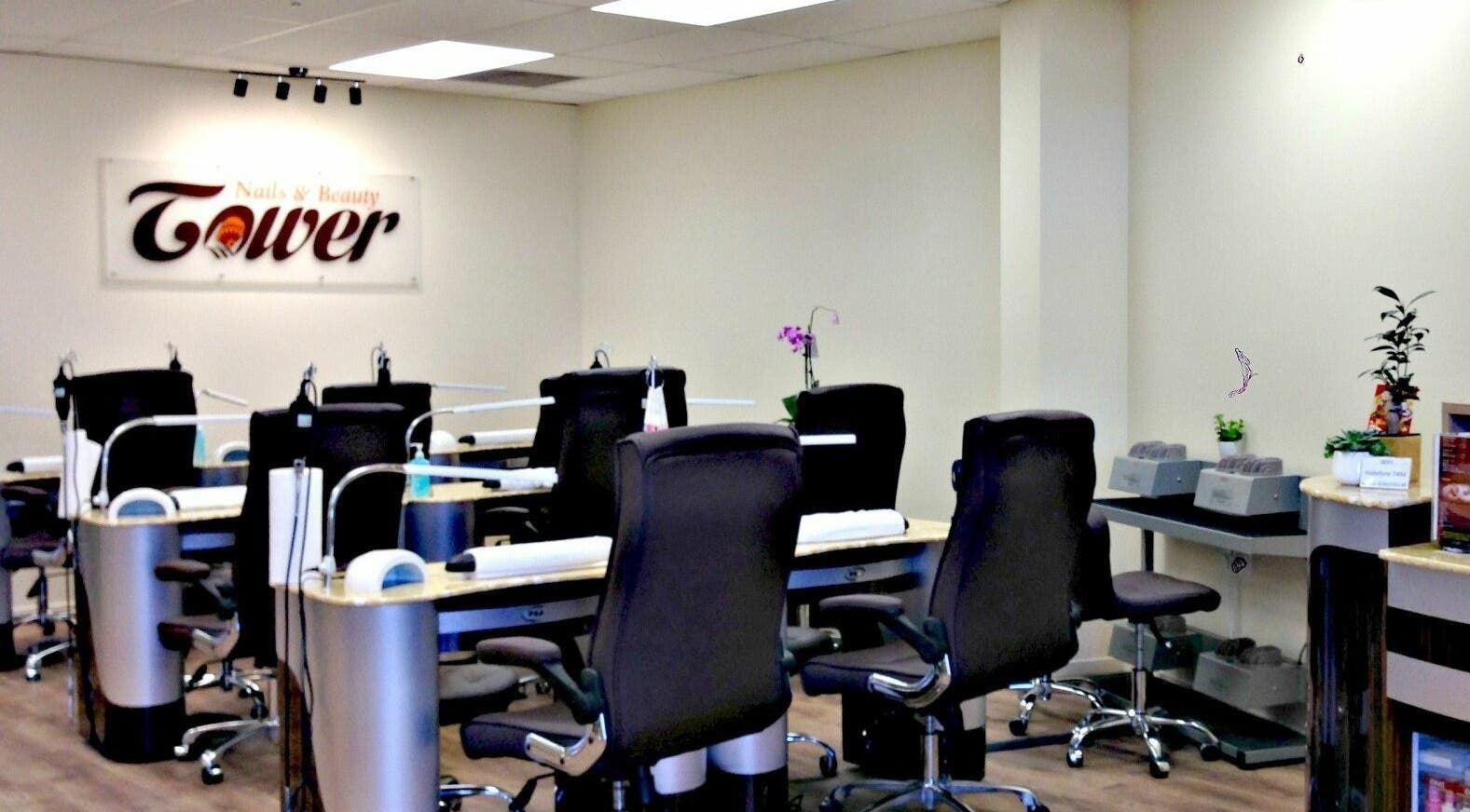 Modern nail salon at Tower Beauty Christchurch, Canterbury, NZ featuring chic workstations and calming decor.