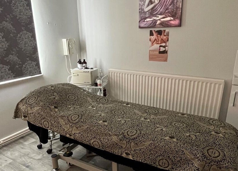 Relaxing treatment room at Beauty & Holistic Therapy, Thornaby, England, GB featuring a cozy massage table.