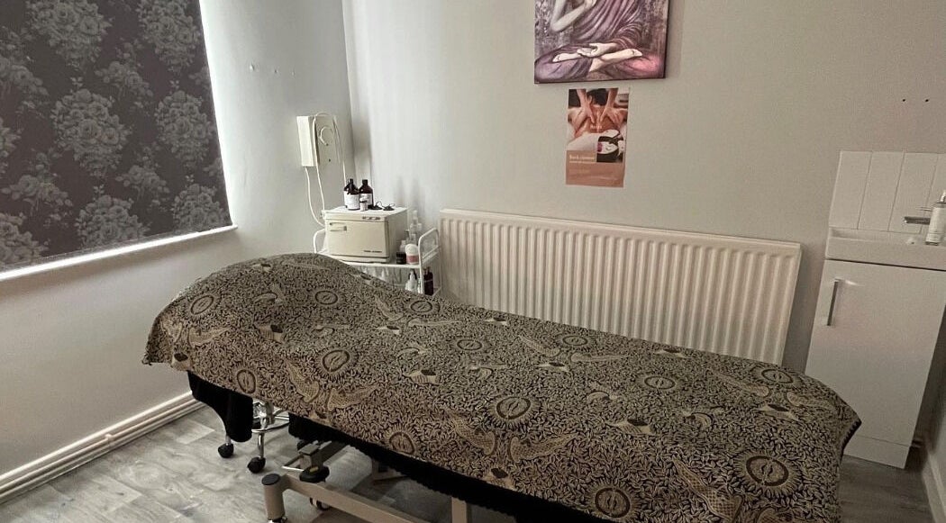Relaxing treatment room at Beauty & Holistic Therapy, Thornaby, England, GB featuring a cozy massage table.