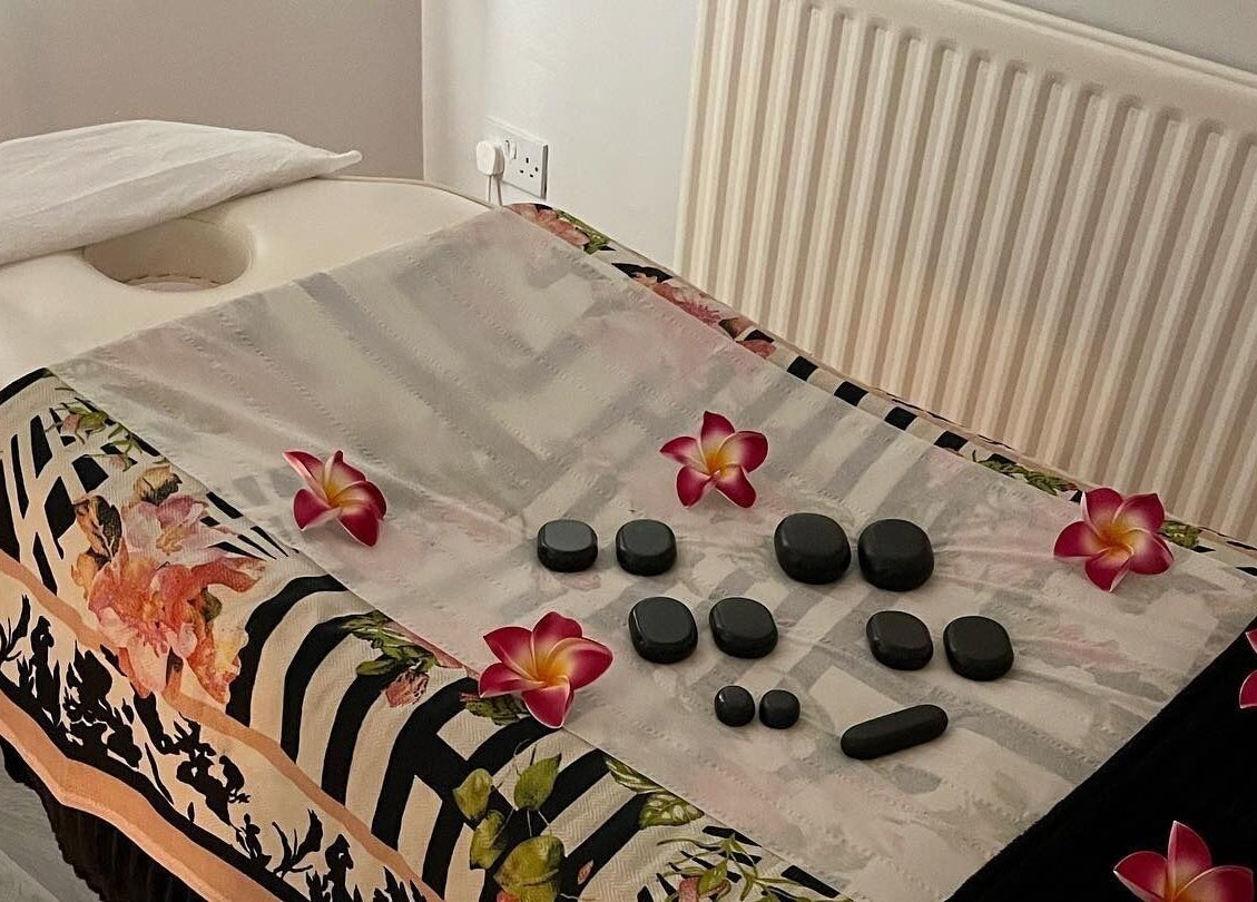 Massage table with hot stones at Beauty & Holistic Therapy, Thornaby, England, GB.