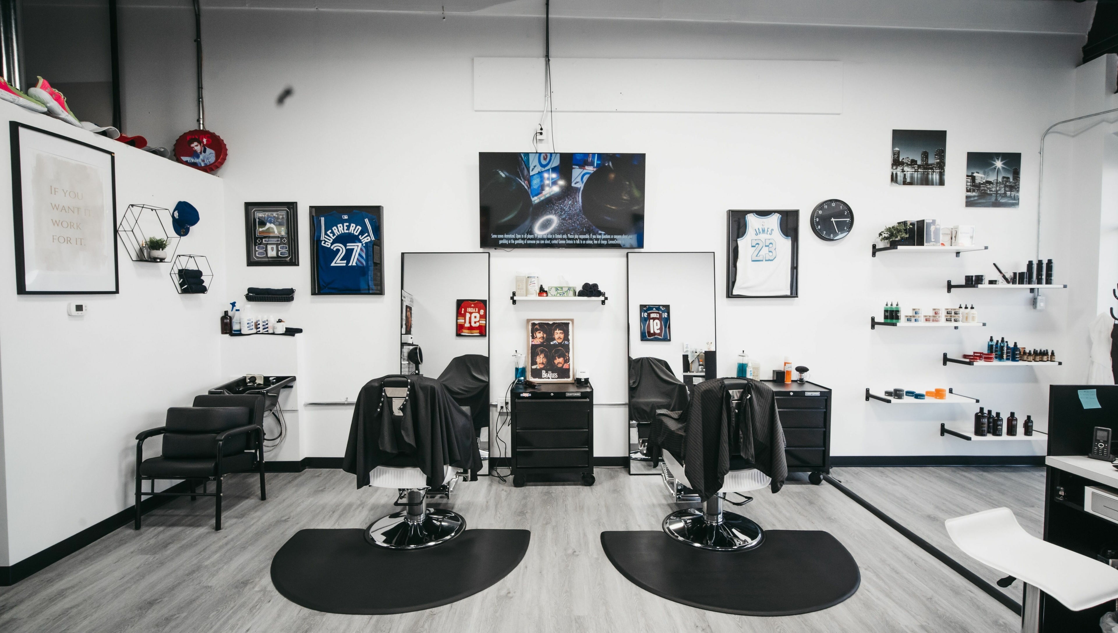 Modern interior of Macleod Trail Barbers in Calgary, Alberta, CA featuring sleek barber chairs and stylish decor.
