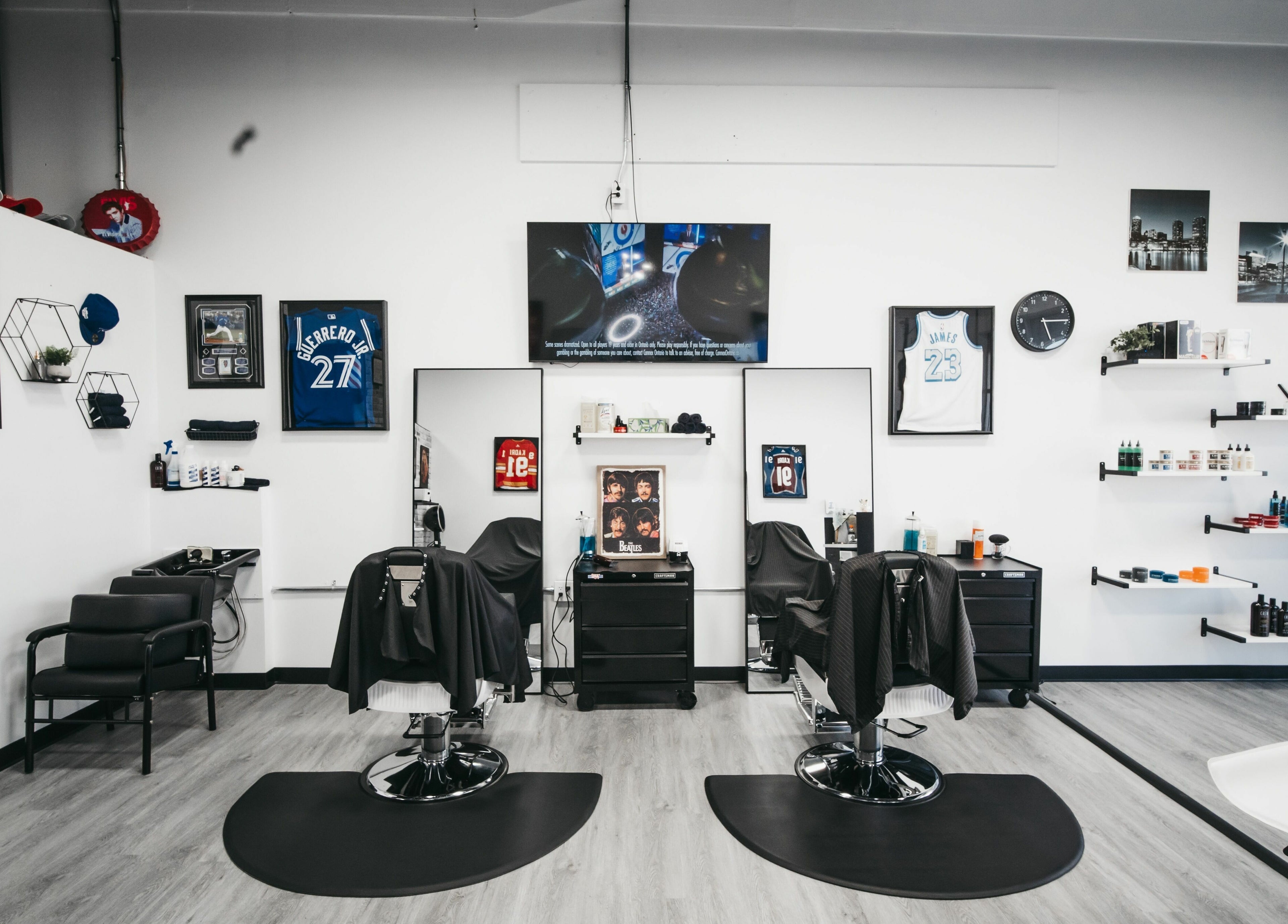 Modern interior of Macleod Trail Barbers in Calgary, Alberta, CA featuring sleek barber chairs and stylish decor.