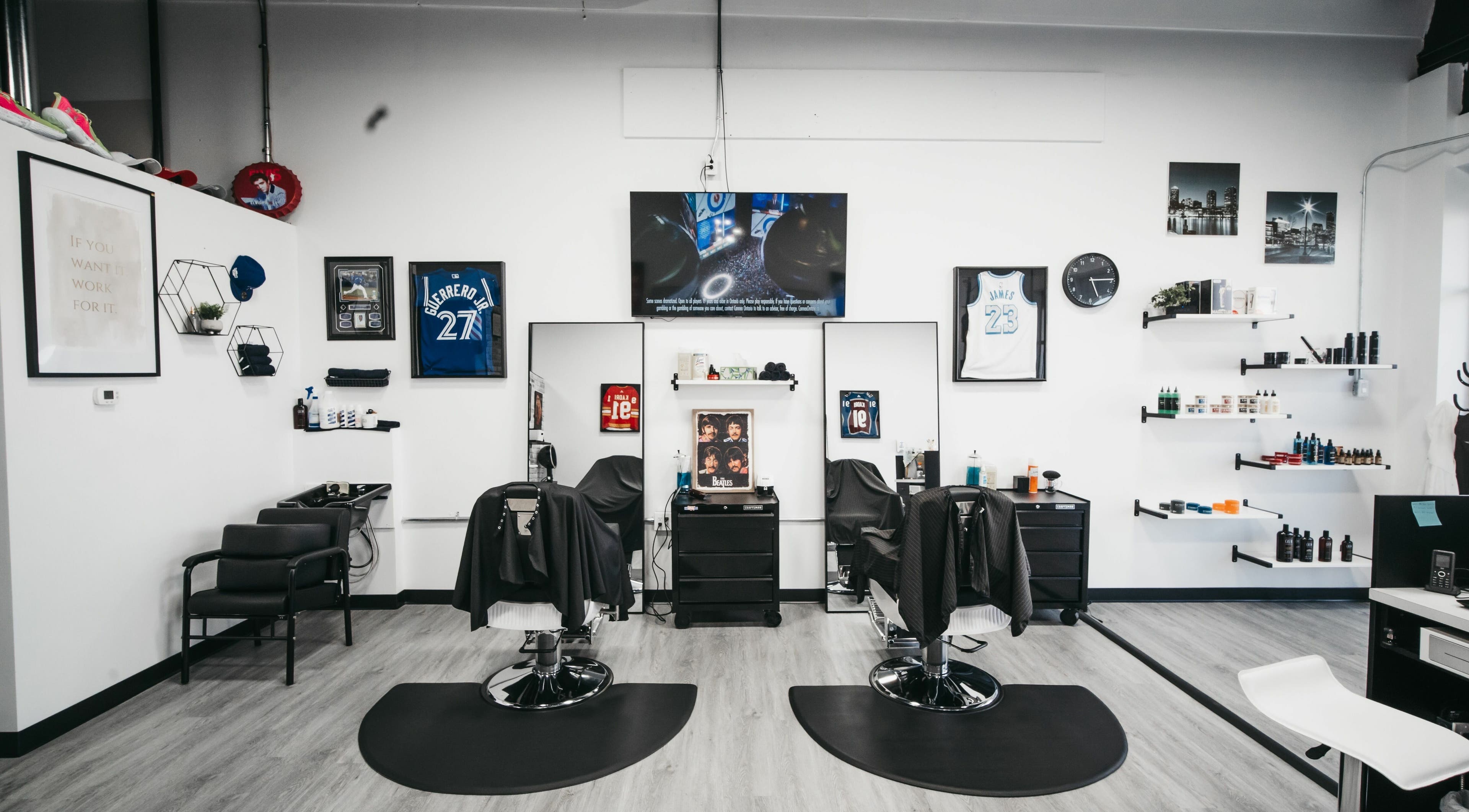Modern interior of Macleod Trail Barbers in Calgary, Alberta, CA featuring sleek barber chairs and stylish decor.