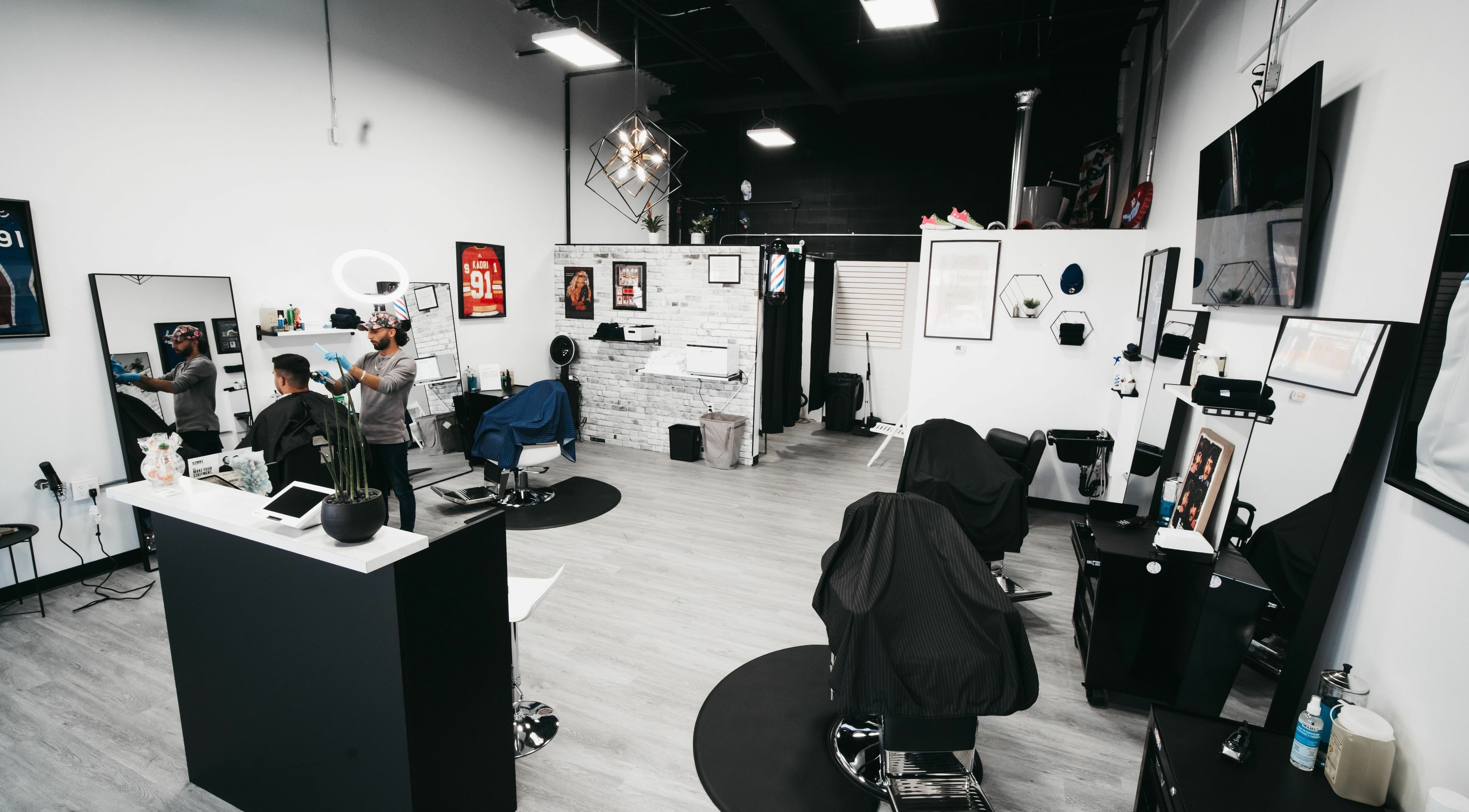 Spacious interior of Macleod Trail Barbers, Calgary, Alberta, CA, featuring sleek decor and professional barber chairs.