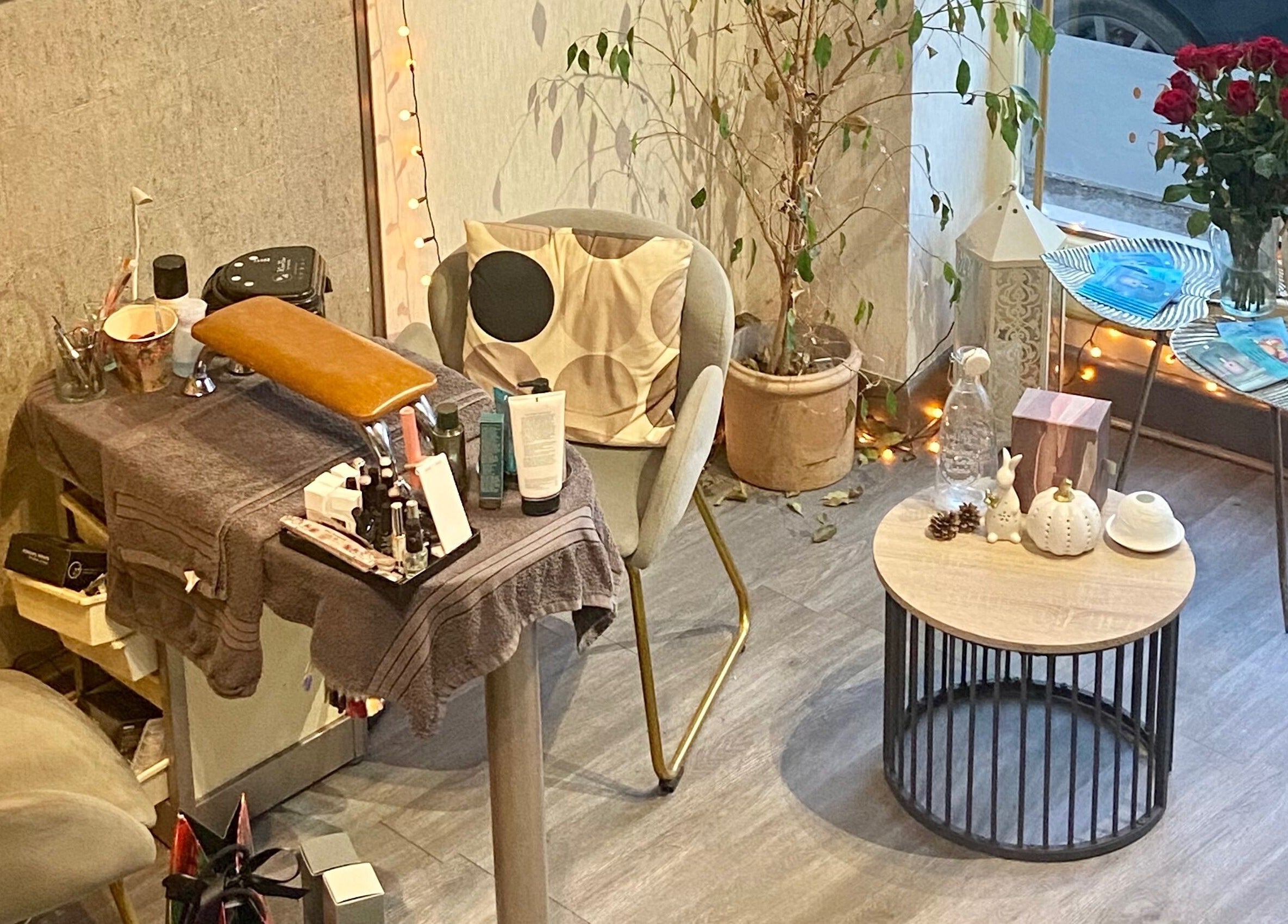 Cozy beauty salon corner at Celestial Glow, Brockenhurst, England. Features manicure setup and decor.