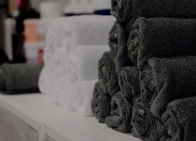 Rolled towels at Danilo Possato Hair Studio, Dublin, County Dublin, IE providing luxury and comfort.
