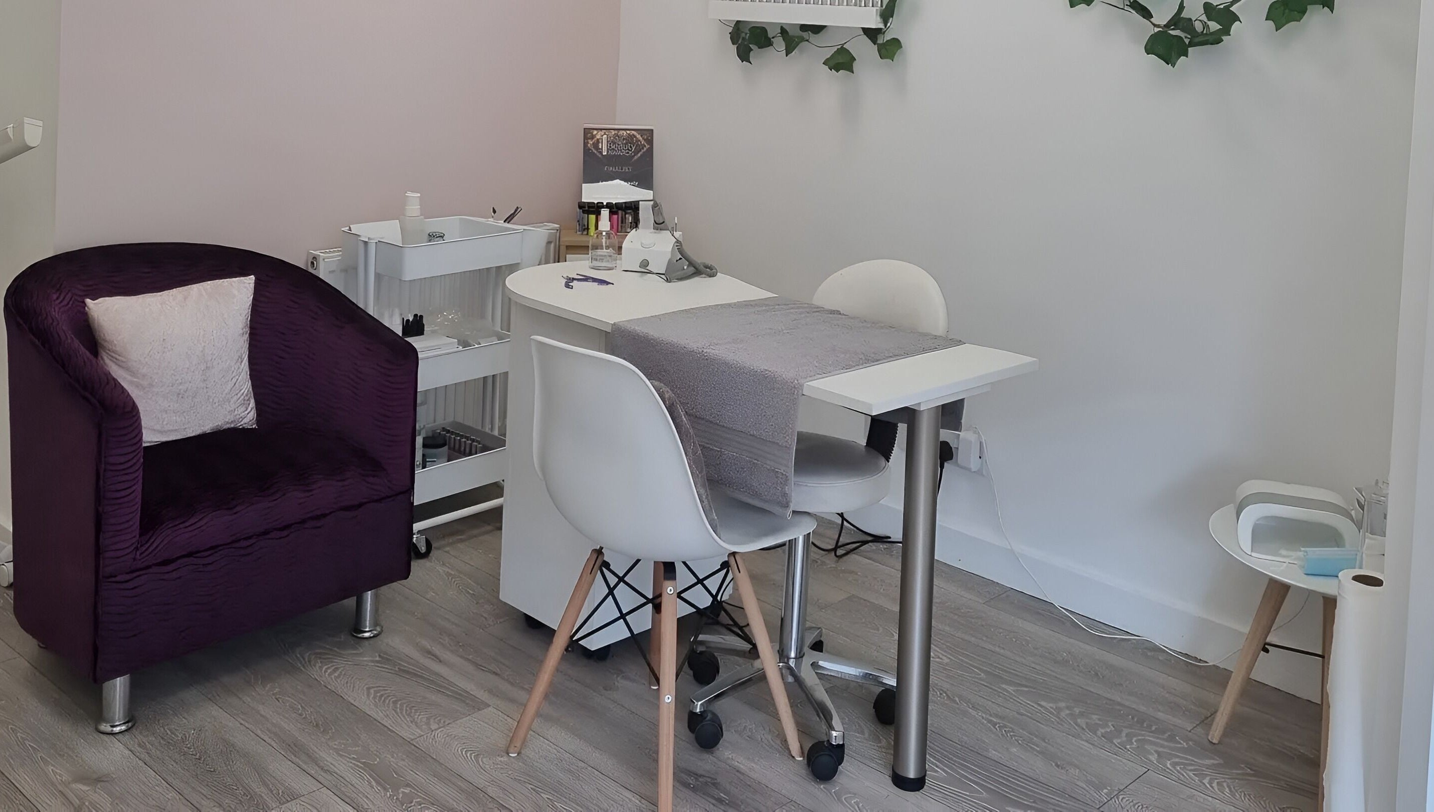 Cozy manicure area at Loubelle Beauty in Aberdeen, Scotland, GB, featuring elegant seating and decor.