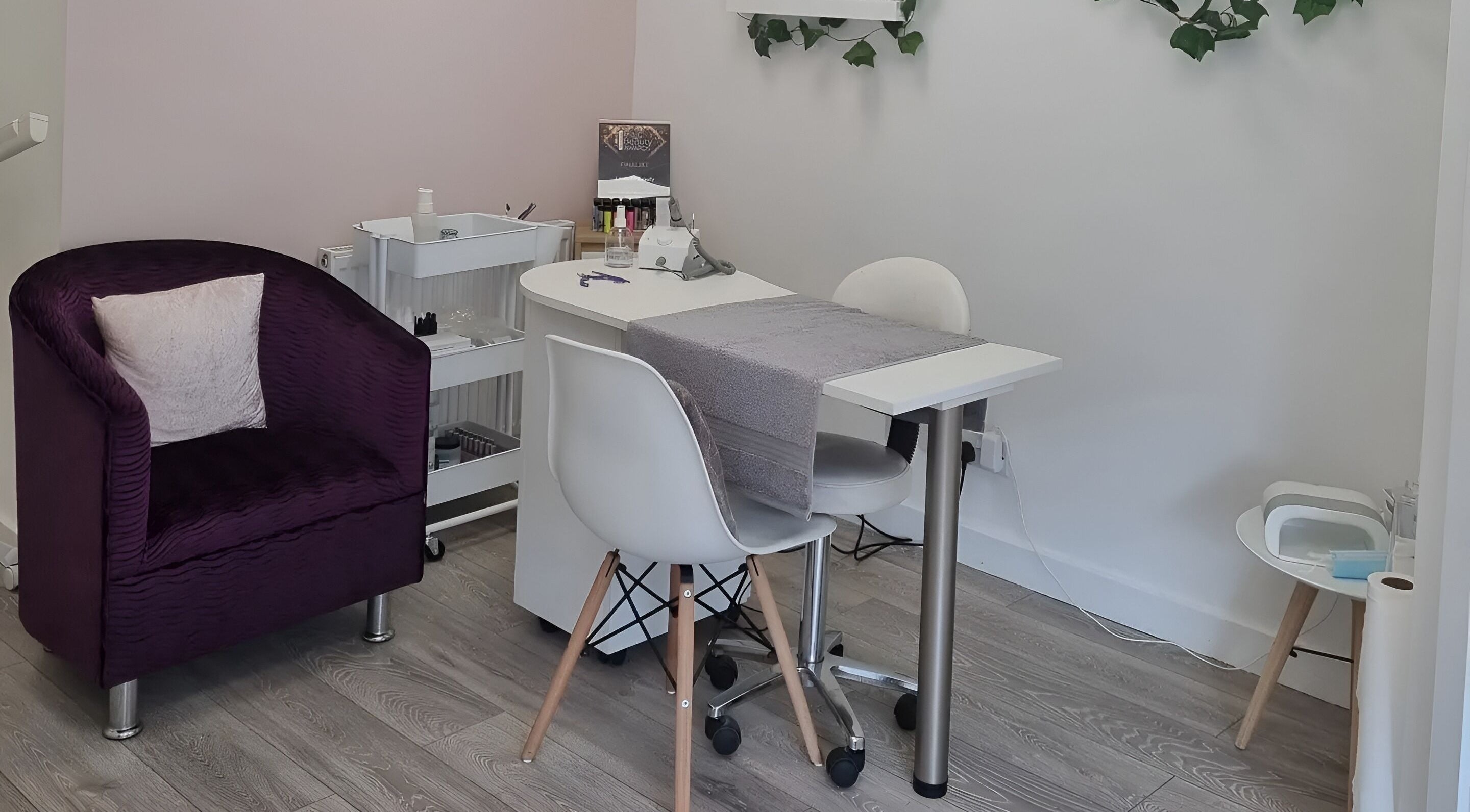 Cozy manicure area at Loubelle Beauty in Aberdeen, Scotland, GB, featuring elegant seating and decor.