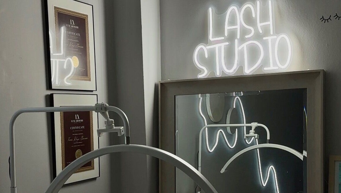 Femme Theory Lash Studio with glowing sign and certifications, London, Ontario, CA.