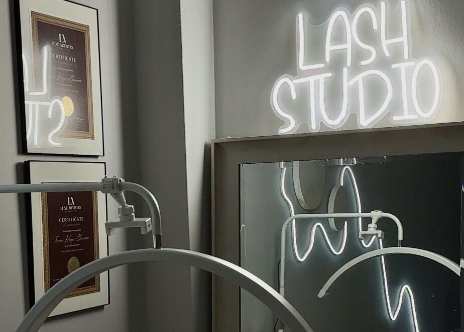 Femme Theory Lash Studio with glowing sign and certifications, London, Ontario, CA.
