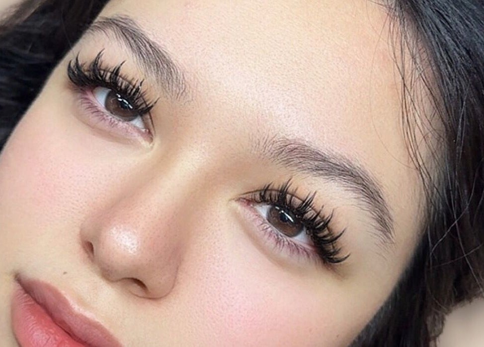 Stunning eyelash extensions at Femme Theory, London, Ontario, CA, showcasing dramatic eye enhancement.