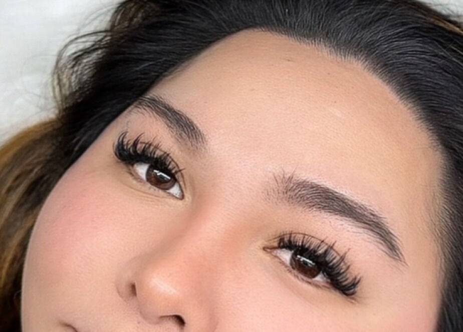 Close-up of expertly styled eyelashes at Femme Theory, London, Ontario, CA, showcasing beauty expertise.