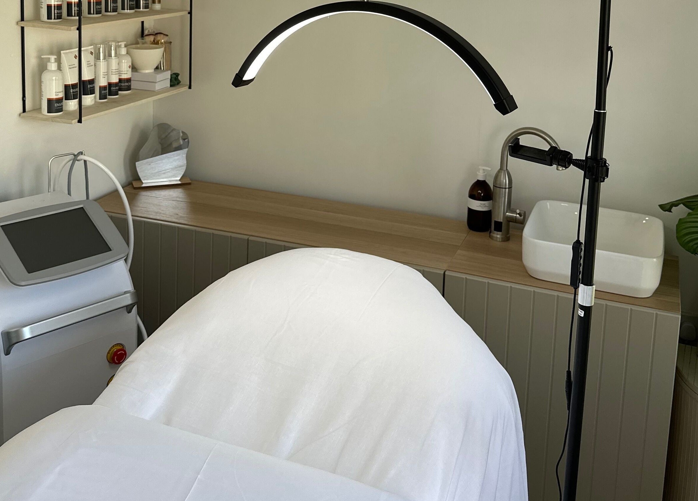 The Advanced Skin Cabin in Peterborough, England, GB. Display of a serene treatment space with skincare products.