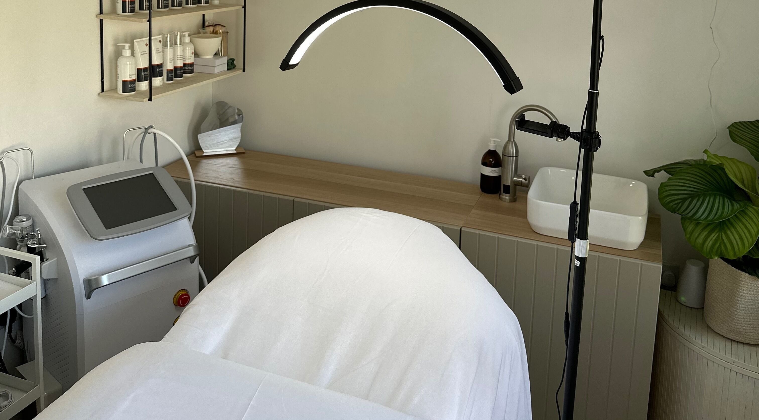 The Advanced Skin Cabin in Peterborough, England, GB. Display of a serene treatment space with skincare products.