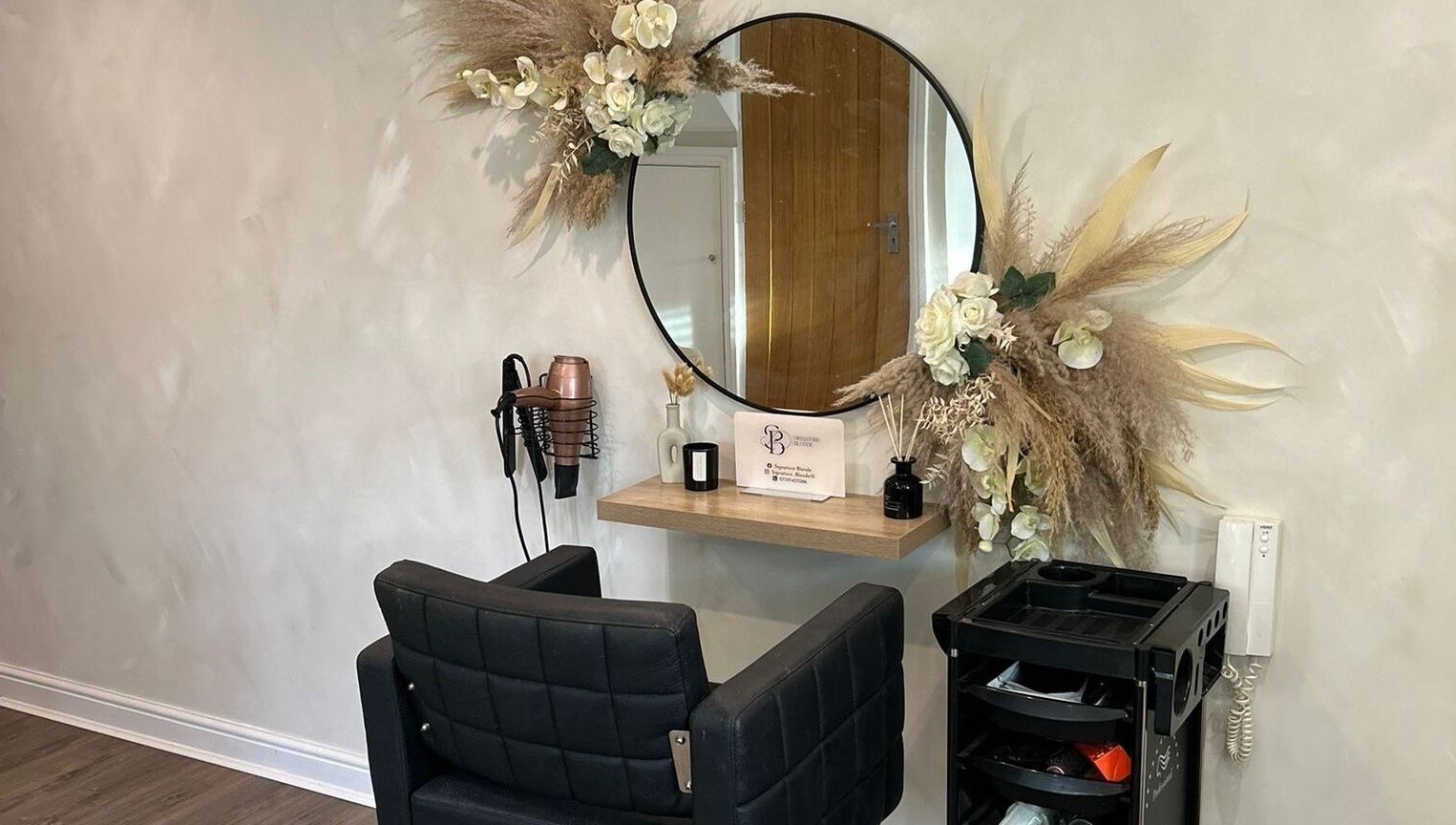 Elegantly decorated salon space at Signature Blonde, Leeds, England, GB featuring a modern styling station.