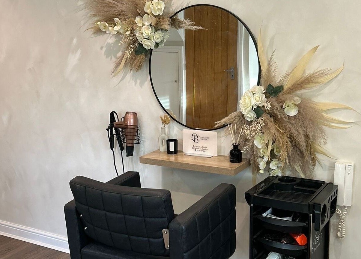 Elegantly decorated salon space at Signature Blonde, Leeds, England, GB featuring a modern styling station.