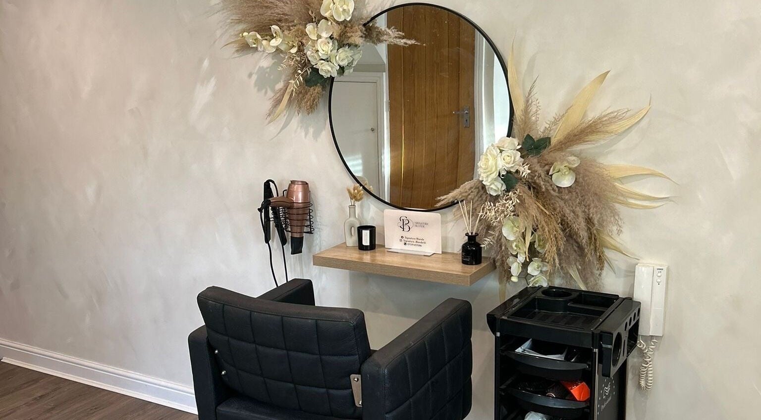 Elegantly decorated salon space at Signature Blonde, Leeds, England, GB featuring a modern styling station.