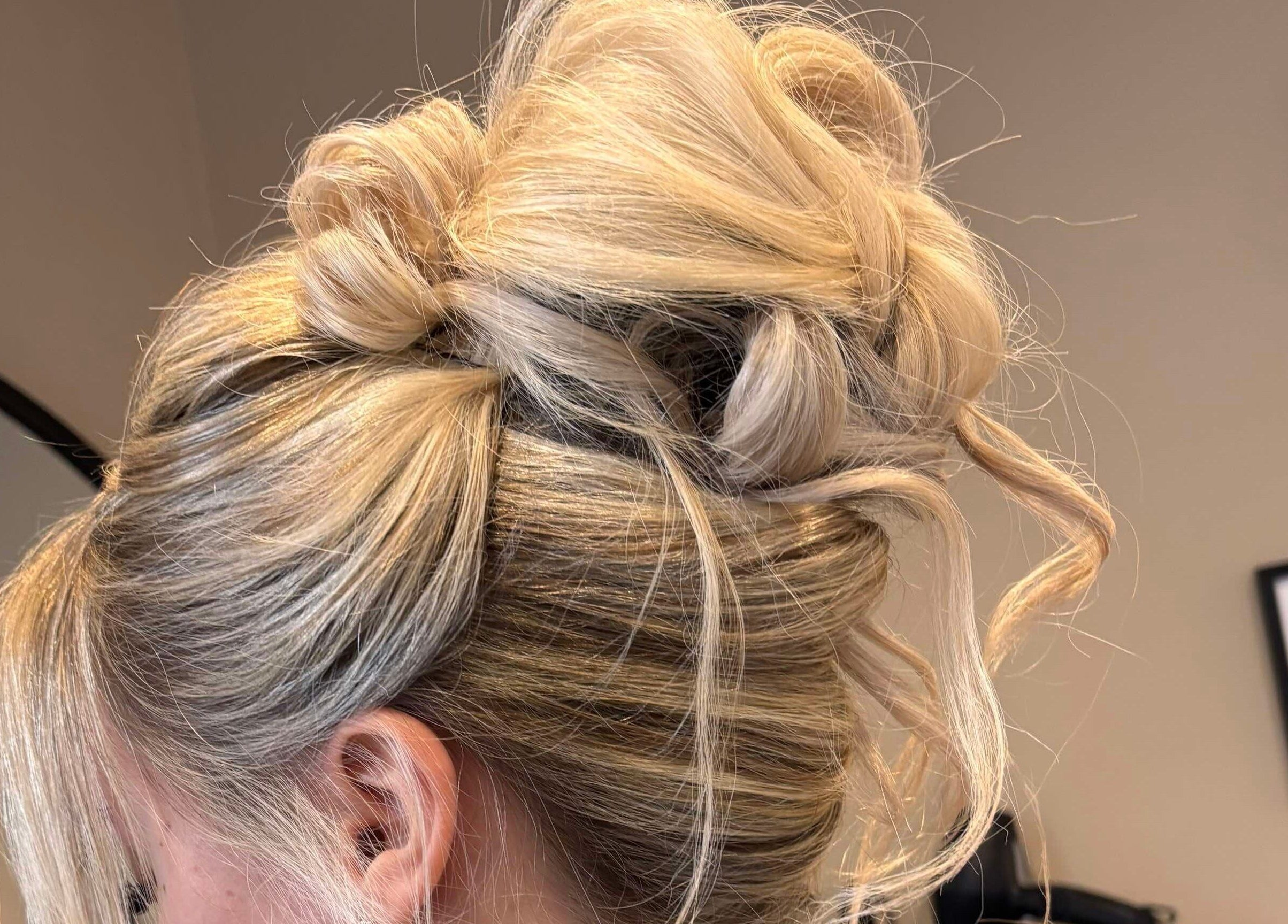 Stylish blonde updo at Signature Blonde, Leeds, England, GB salon.