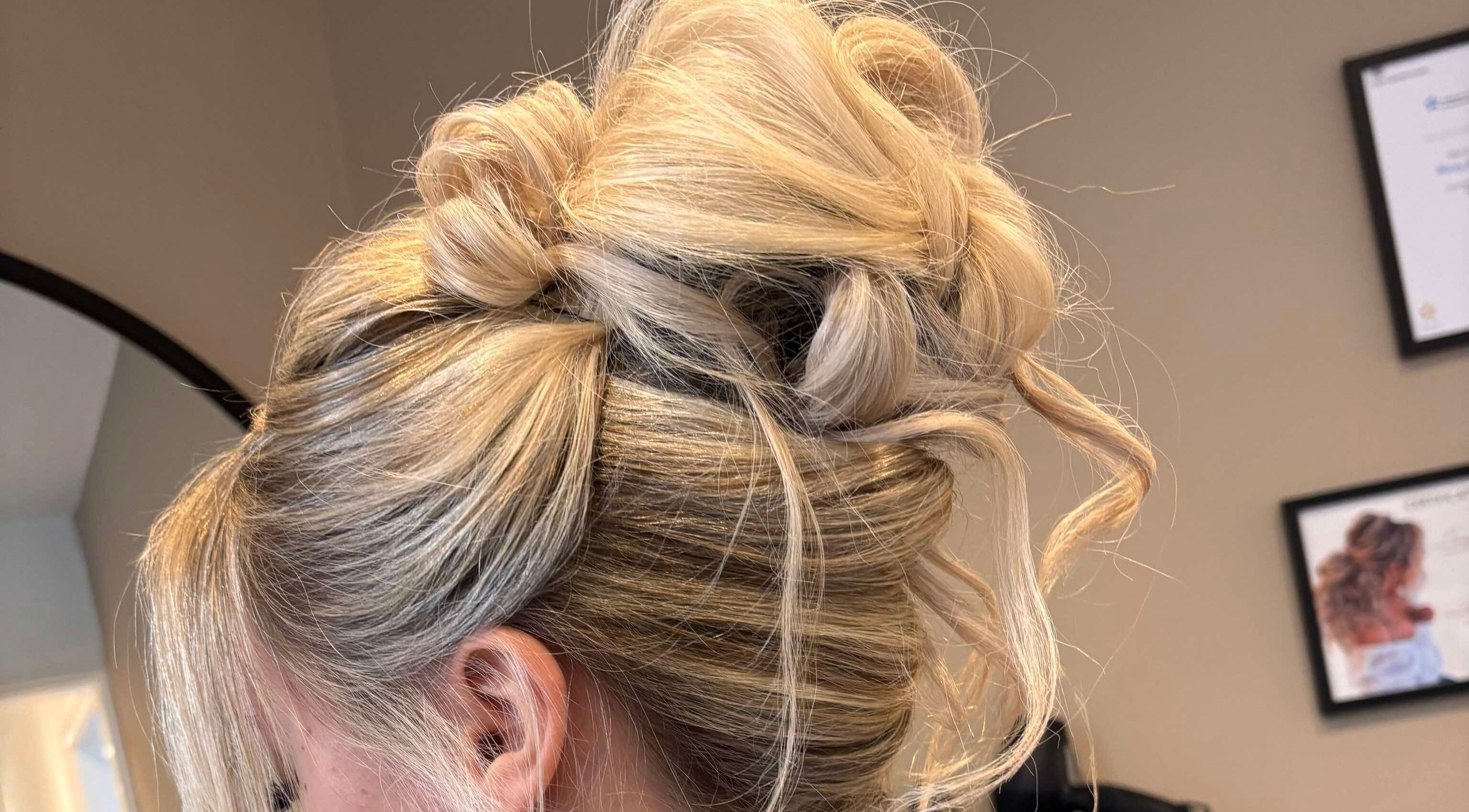 Stylish blonde updo at Signature Blonde, Leeds, England, GB salon.