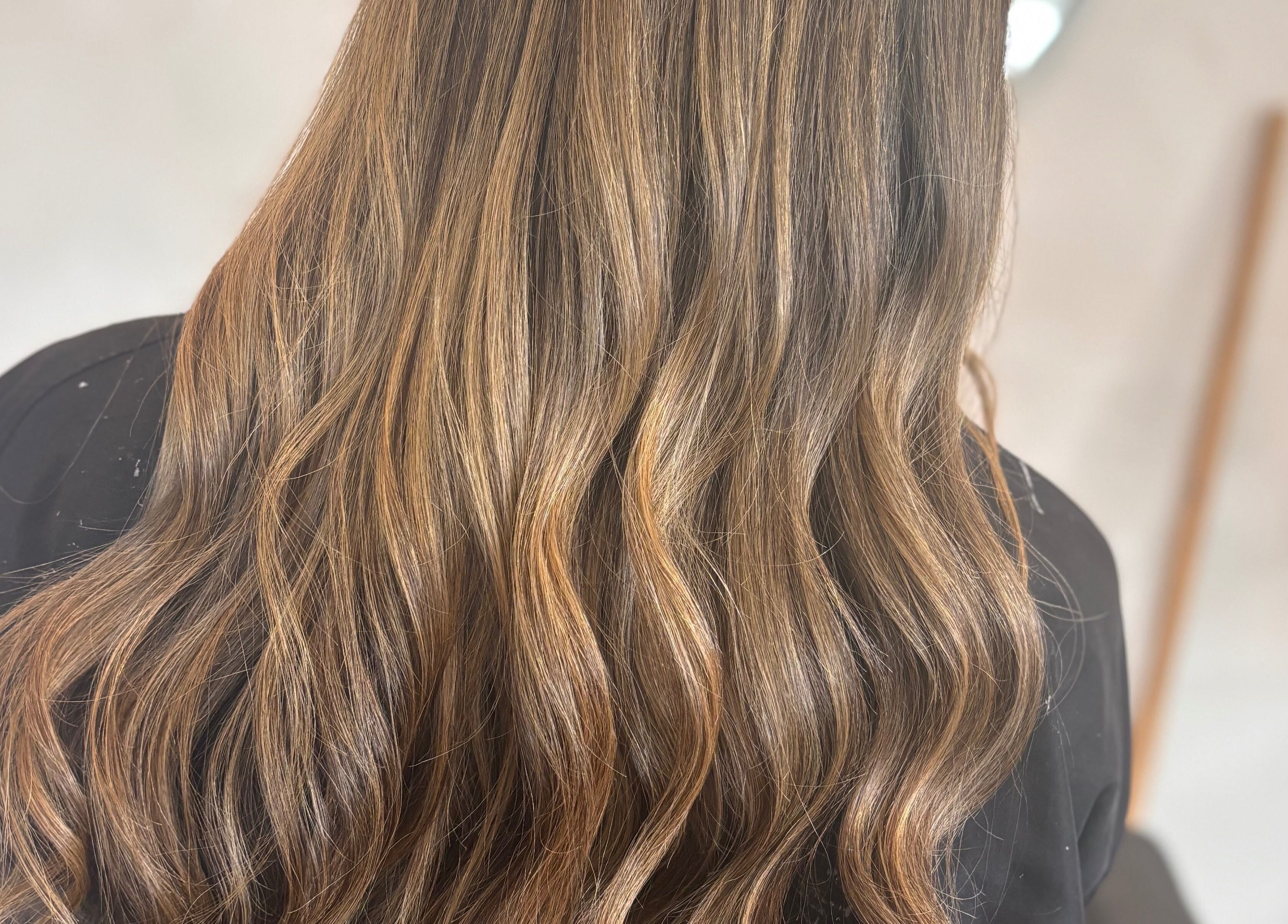 Flowing blonde hair styled at Signature Blonde, Leeds, England, GB, showcasing rich texture and shine.