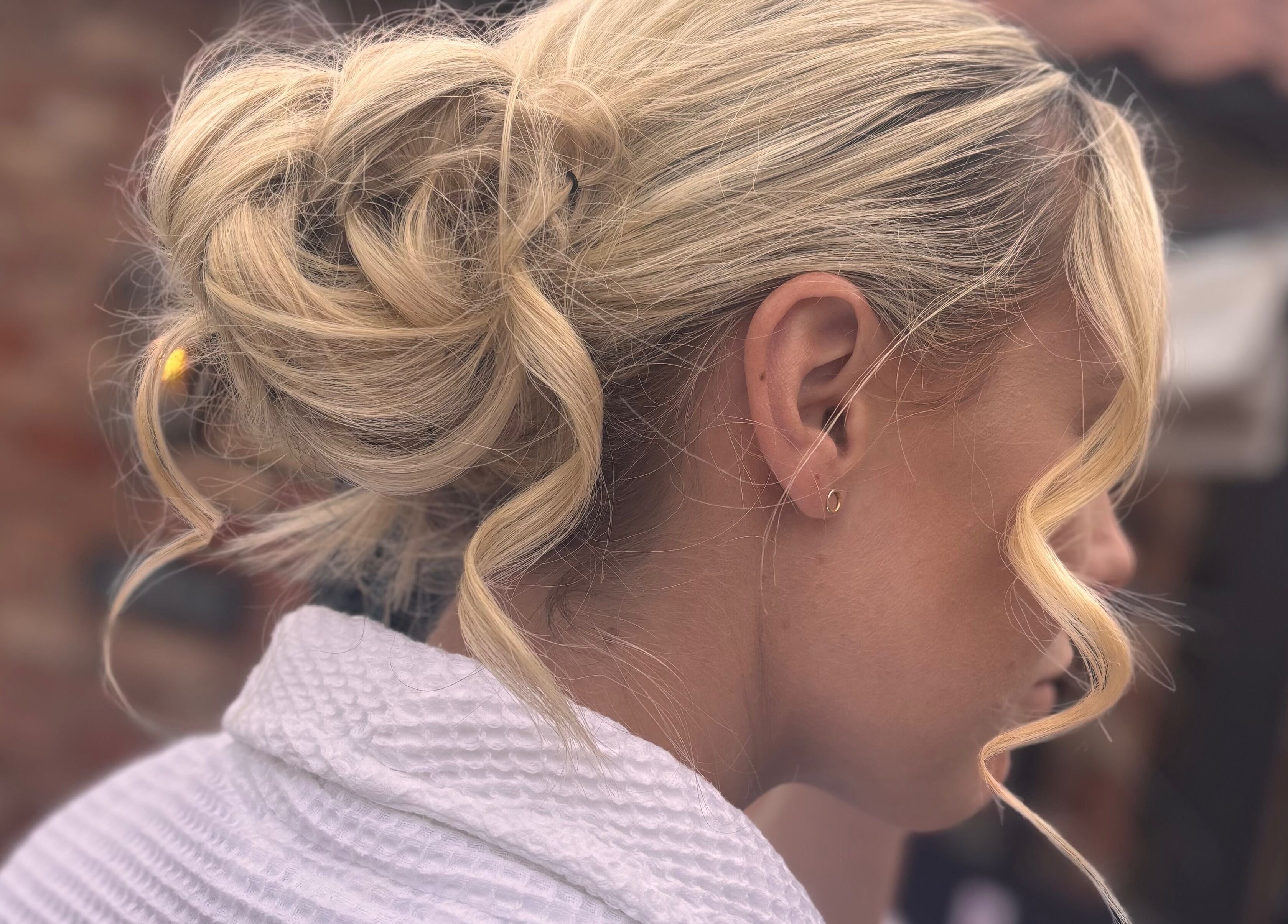 Blonde updo hairstyle at Signature Blonde salon in Leeds, England, GB.
