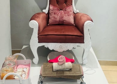 Elegant pedicure setup at Sempré Bella by Noushka, Johannesburg, Gauteng, ZA, featuring a plush chair and spa essentials.