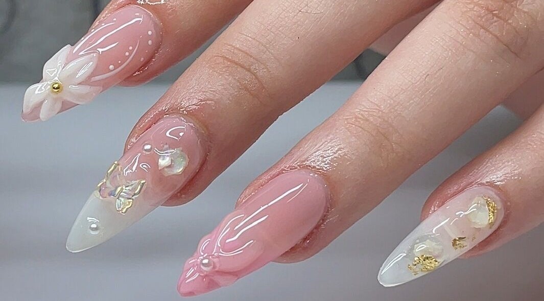 Intricate nail art design at BEIGE Nails And Spa, Vancouver, British Columbia, CA showcasing floral accents.