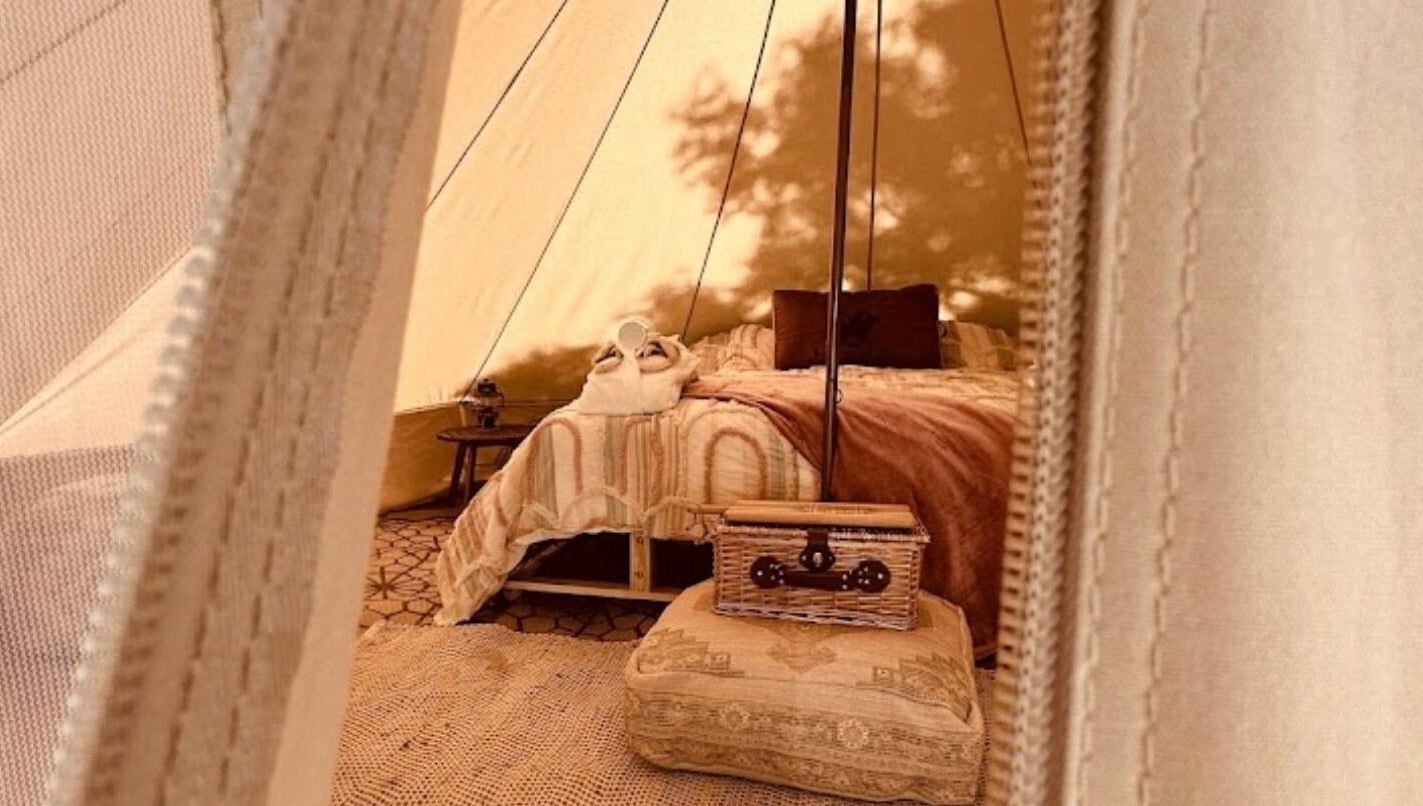 Luxurious tent interior at Be Well with Brooke, Oura, New South Wales, AU offering a serene escape.