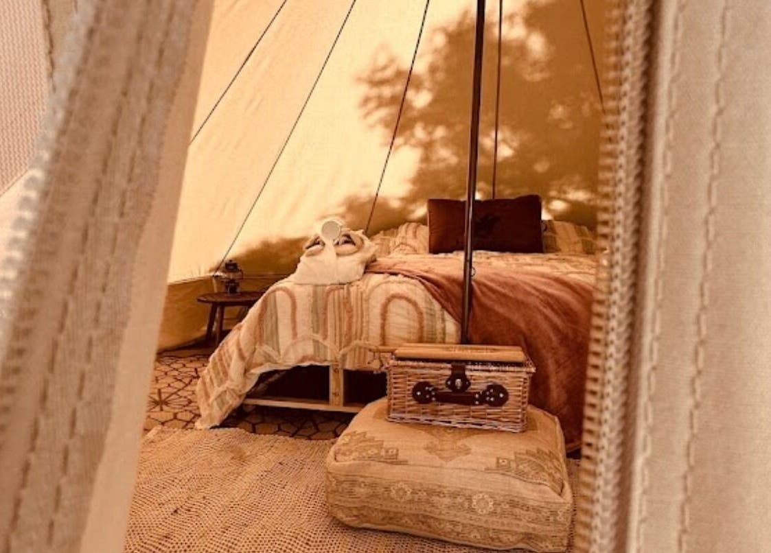 Luxurious tent interior at Be Well with Brooke, Oura, New South Wales, AU offering a serene escape.