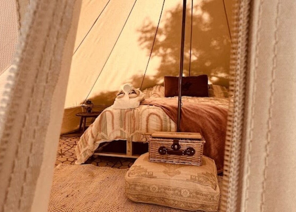 Luxurious tent interior at Be Well with Brooke, Oura, New South Wales, AU offering a serene escape.