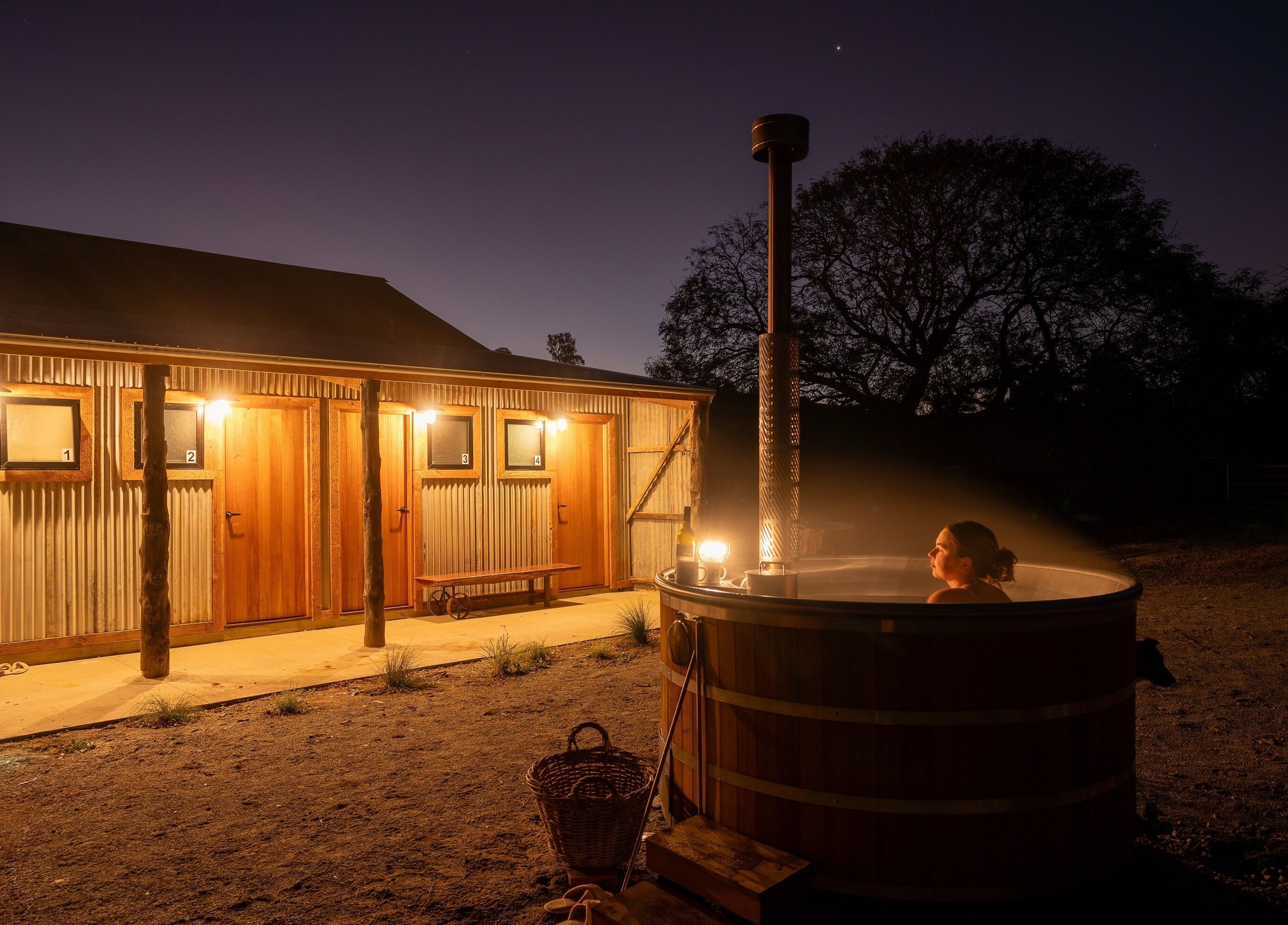 Evening hot tub relaxation at Be Well with Brooke, Oura, New South Wales, AU, under a starry sky.