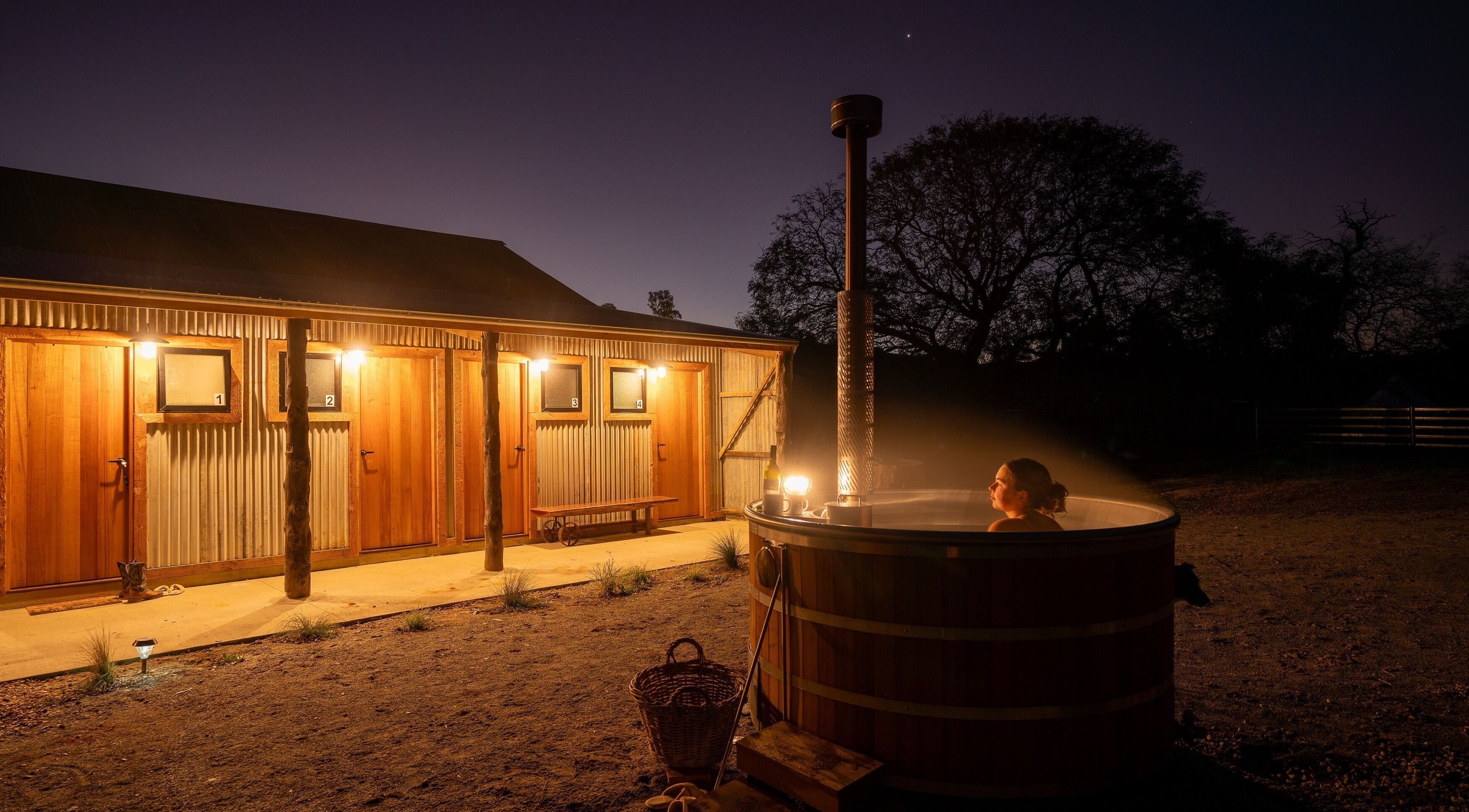 Evening hot tub relaxation at Be Well with Brooke, Oura, New South Wales, AU, under a starry sky.