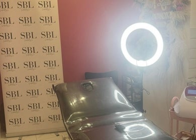 Eme Beauty Studios treatment room with sleek chair and light setup in Dudley, England, GB.