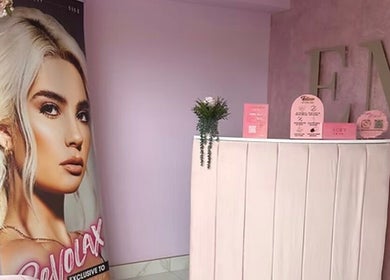 Stylish reception at Eme Beauty Studios in Dudley, England, GB with elegant decor and poster display.