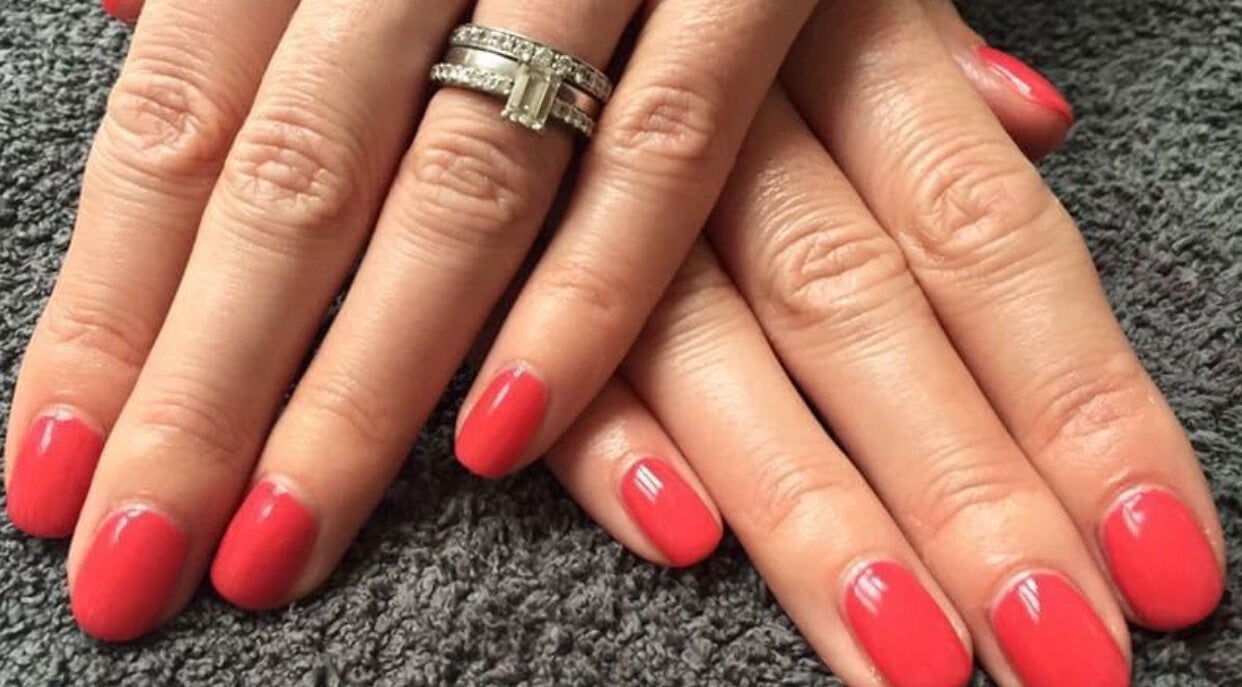 Elegant red manicure by Mobile Hertfordshire Nail Technician in St. Albans, England, GB. Perfectly styled nails.
