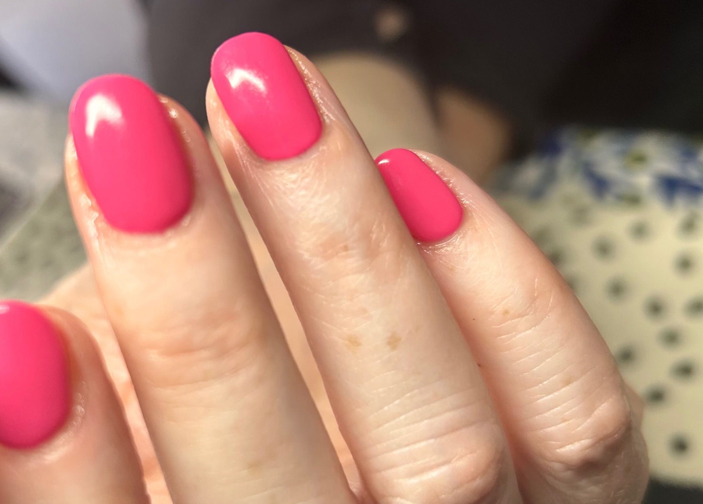 Vibrant pink nails by Mobile Hertfordshire Nail Technician in St.albans, England, GB showcasing expert craftsmanship.