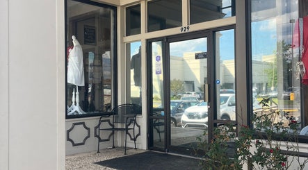 Entrance of Shear Heaven Salon showcasing modern glass doors in Ruston, Louisiana, US.