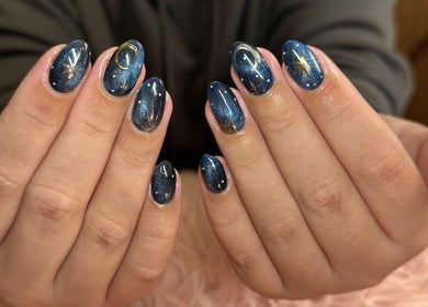 Starry nail art at Nails n Beauty by Soph, Taverham, England, GB. Perfect for chic cosmic style.