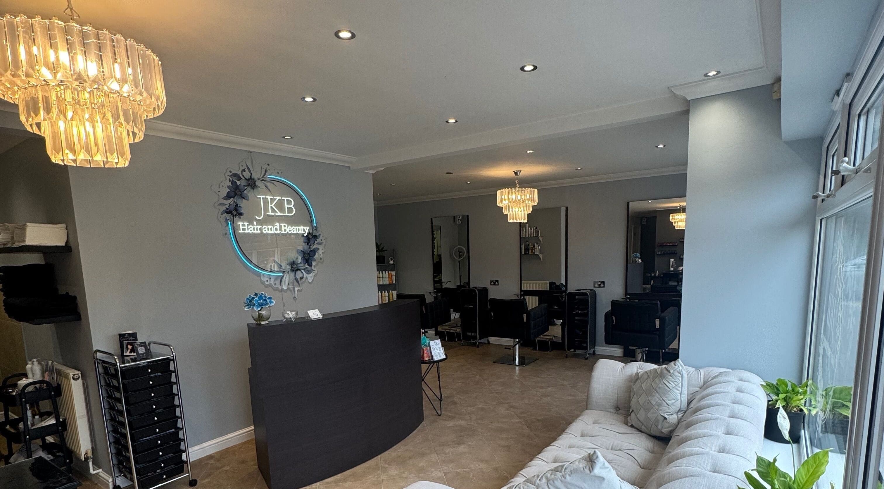 Stylish salon interior at JKB Hair and Beauty, Drayton, England, GB with chic decor and seating.